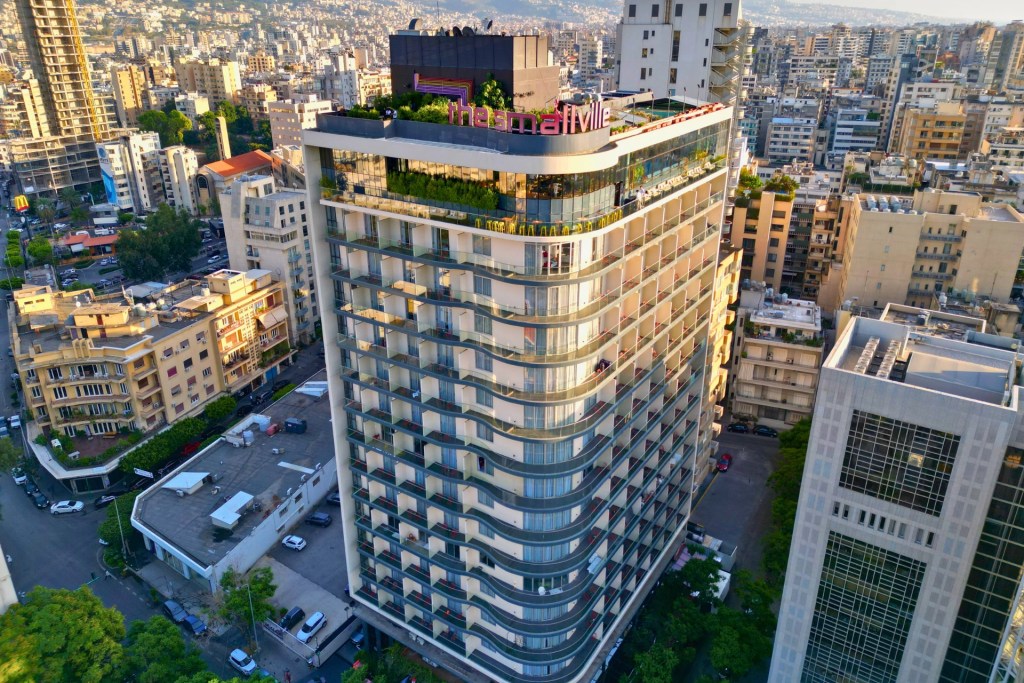 Superhero-themed hotel room at The Smallville Hotel in Beirut, featuring bold colors, comic-style artwork, and modern design elements for a unique stay experience.